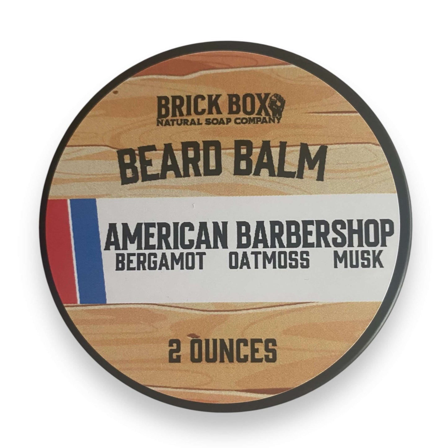 a tin of American Barbershop Beard Balm by Brick Box