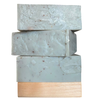 A stack of three bars of Blueberry Trail soap from Brick Box Natural Soap Company